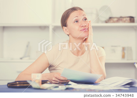 Woman worried about debts Woman worried about debts 34743948