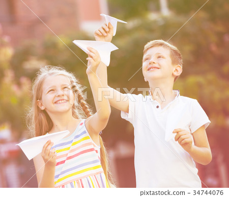 kids playing airplane toys 34744076