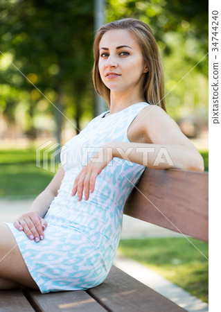 portrait of cheerful young woman portrait in outdoor 34744240