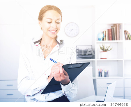 business woman with clipboard business woman with clipboard 34744958