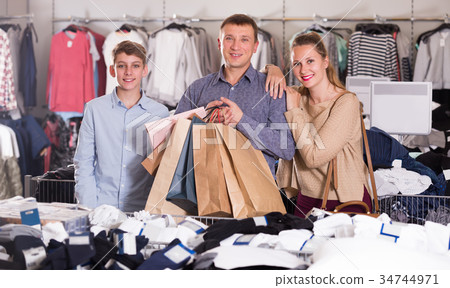 Two generations showing shopping bags 34744971