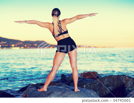 Female is practicing stretching 34745001