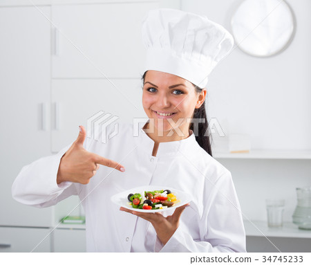 Brunette girl cook and salad 34745233