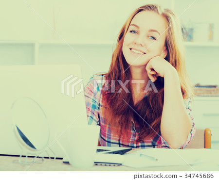 Girl working on laptop Girl working on laptop 34745686