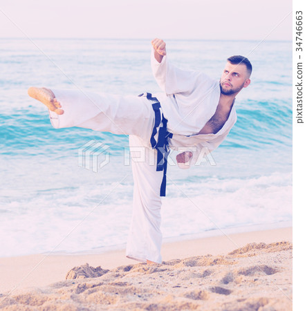 Guy doing karate poses 34746663