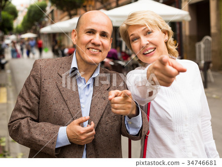 couple walking in town 34746681