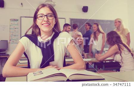 students chatting while sitting in the room students chatting while sitting in the room 34747111