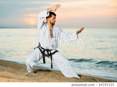 Adult male is training the Kokutsu-dachi stance 34747135