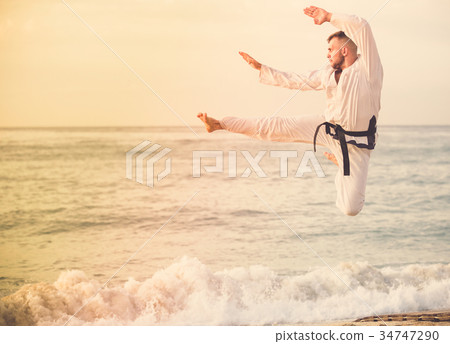 Nice male practising karate kata poses 34747290