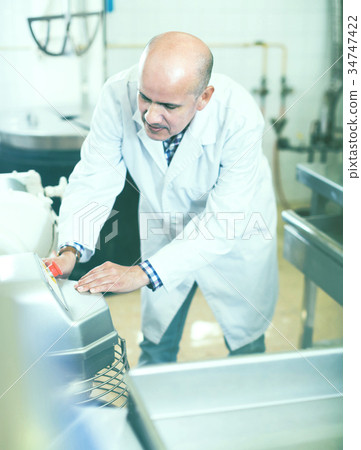 Portrait of mature man working in modern food factory 34747422