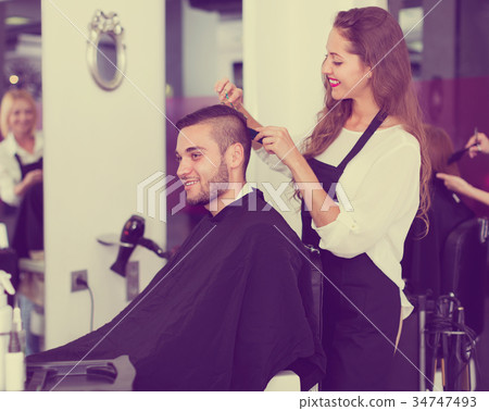 Young man at the hair salon. . Young man at the hair salon. . 34747493