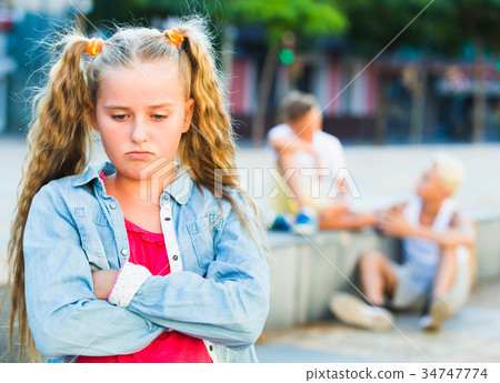 Sad girl having problems in relationship with friends Sad girl having problems in relationship with friends 34747774