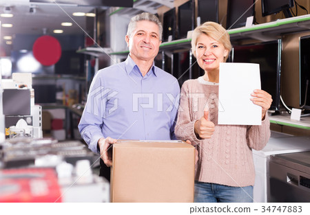 Persons are buying in store on credit Persons are buying in store on credit 34747883