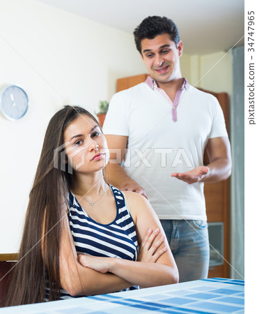Man trying to reconcile with woman. 34747965