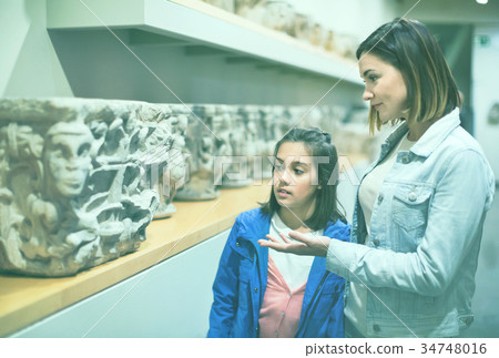 Mother and daughter regarding classical bas-reliefs Mother and daughter regarding classical bas-reliefs 34748016