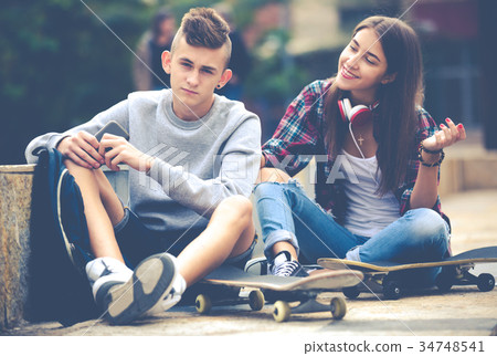 Teenage friends making things up after quarrel 34748541