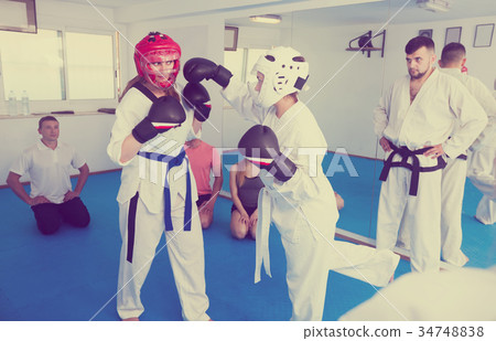 Women practicing at taekwondo class 34748838