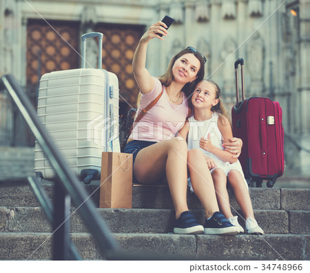 Female tourists taking selfie Female tourists taking selfie 34748966