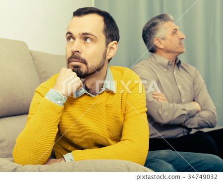 Adult father and son solve problems Adult father and son solve problems 34749032