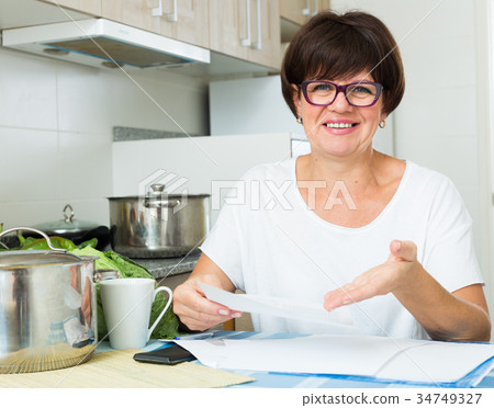 smiling woman bills 34749327
