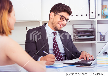 Colleagues meeting in office Colleagues meeting in office 34749478