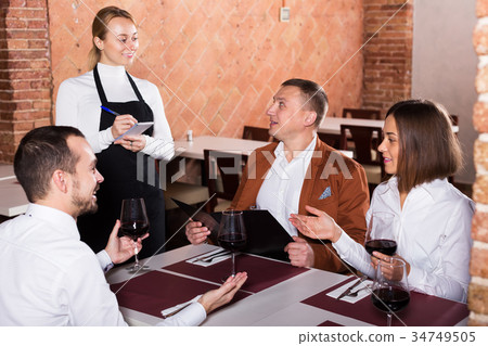 Waitress taking order in restaurant 34749505