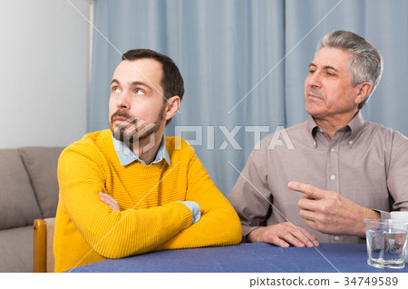Mature father and son serious talk Mature father and son serious talk 34749589
