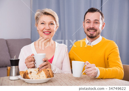 Mature mother and son breakfast 34749622
