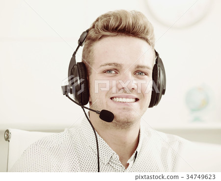 Portrait of male employee with headset 34749623