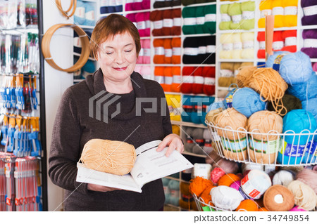 Mature woman in yarn shop Mature woman in yarn shop 34749854