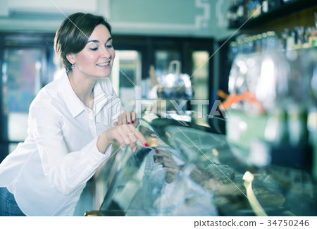 Woman choosing dessert 34750246