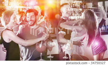 Female with man are dancing in bar 34750327