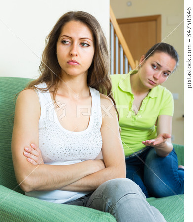 Two young women after quarrel at home. 34750346