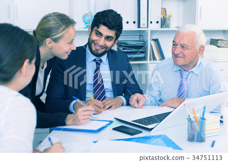 Employees are writing financial reports 34751113