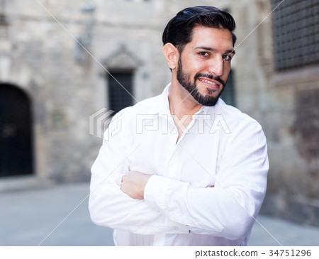 Smiling man keeping arms crossed 34751296