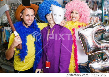 Portrait of happy young coplr with mannequin 34751297