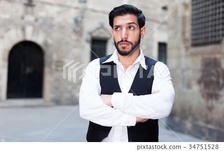 Serious man with arms crossed Serious man with arms crossed 34751528