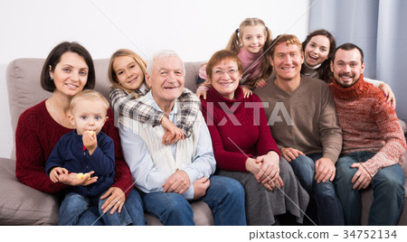 Ordinary family making numerous photos 34752134