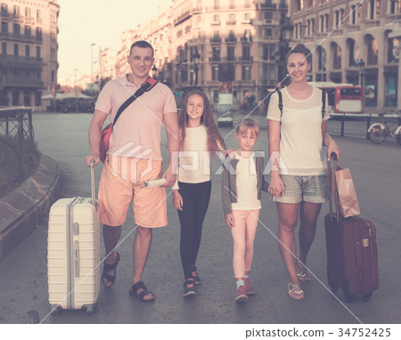 Big family of tourists strolling 34752425