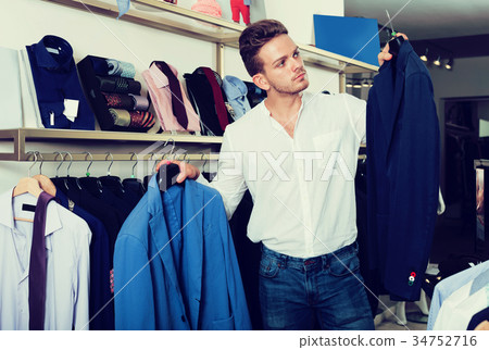 Man purchasing jacket Man purchasing jacket 34752716