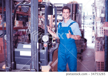 Man in uniform on his workplace 34753265