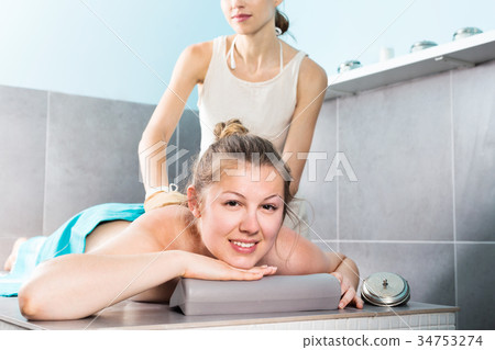 portrait of woman on massage table portrait of woman on massage table 34753274