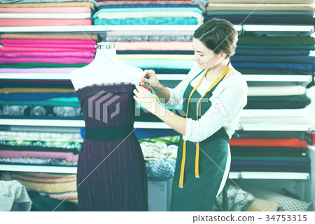 Tailor working at dress Tailor working at dress 34753315
