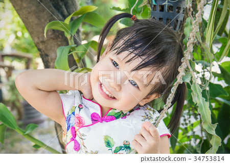 Little oriental girl wishing you a happy Chinese N Little oriental girl wishing you a happy Chinese N 34753814