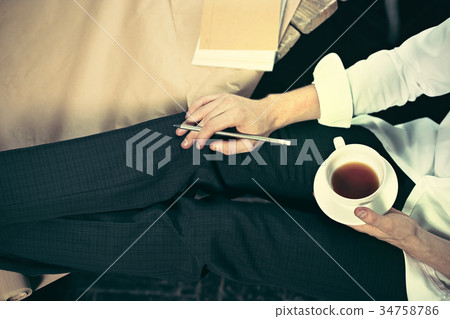 Architect working on drawing table in office Architect working on drawing table in office 34758786