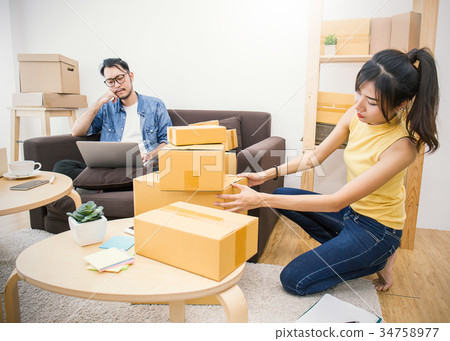 Young Asian man small business owner working Young Asian man small business owner working 34758977