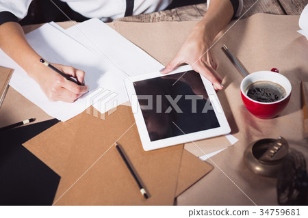 Portrait of a businesswoman who is working at 34759681