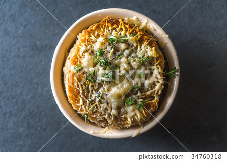 French onion soup with cheese, croutons and thyme French onion soup with cheese, croutons and thyme 34760318