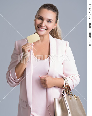 Happy excited surprised woman with credit card Happy excited surprised woman with credit card 34760604