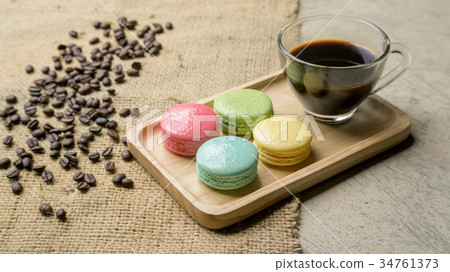 macaroons and a coffee on gray background. macaroons and a coffee on gray background. 34761373